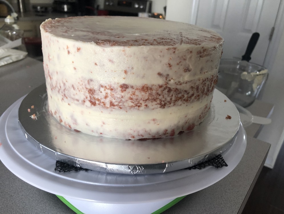 A crumb coated cake