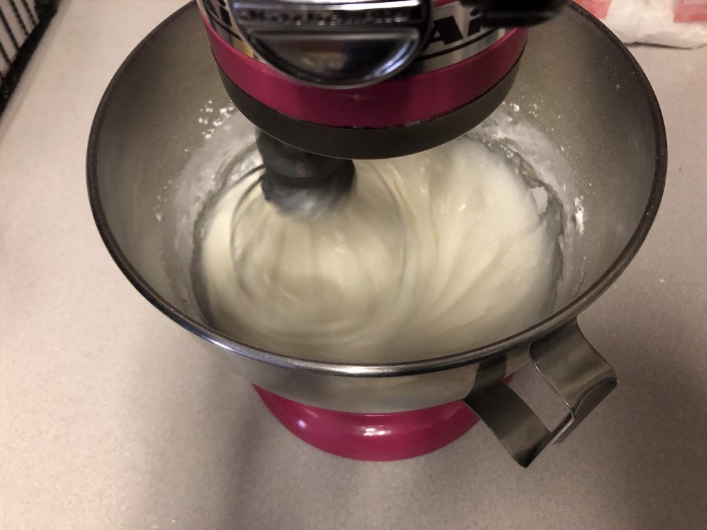 mixing egg whites and powder sugar 